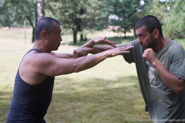 Taikiken defense Jodan tsuki or Boxing Jab, using soft block moving forward.